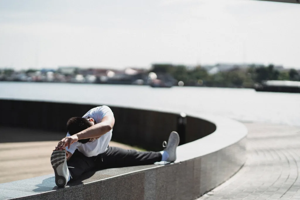 practice of mindful movement with man stretching